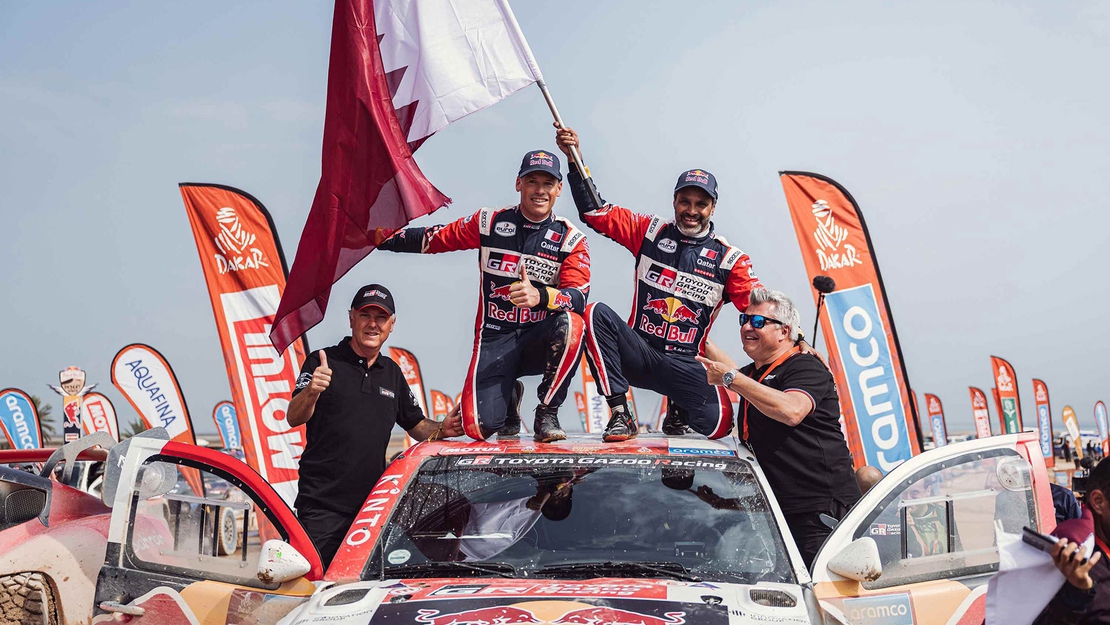 Winners-on-car-Nasser-Al-Attiyah-Dakar.jpg